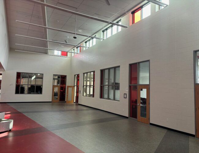 Open corridor area in new addition with painted block walls