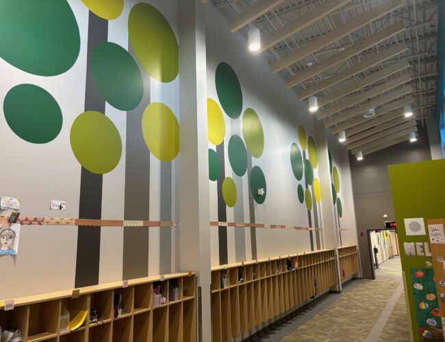 Painted tree graphics in school hallway
