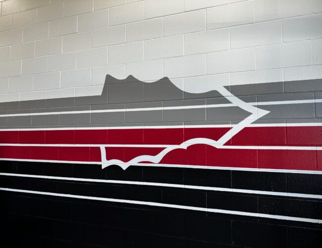 Painted arrow and stripes on concrete block